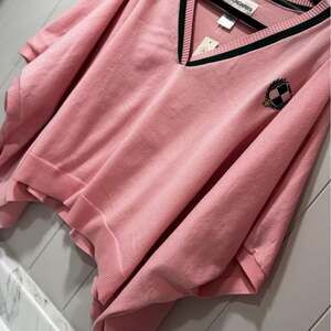 Pink oversized pancho/sweater with black trim